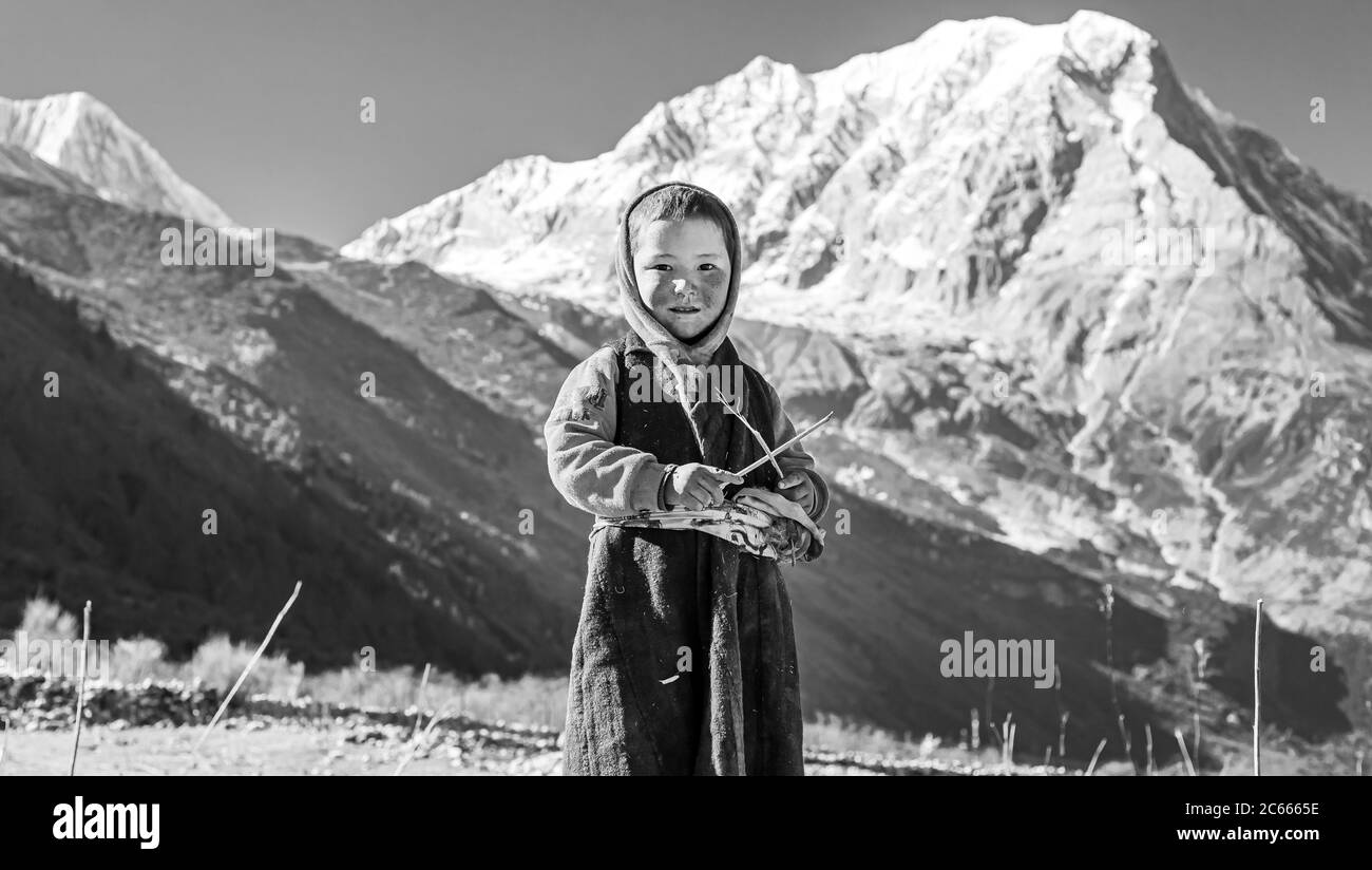 Samagau, Gorkha - December 23 2018: Young beautiful sherpa girl poses infront of the camera. Stock Photo