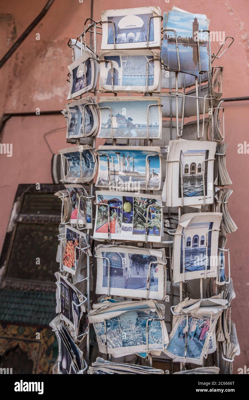 Old postcards on a postcard rack in Marrakech, Morocco Stock Photo