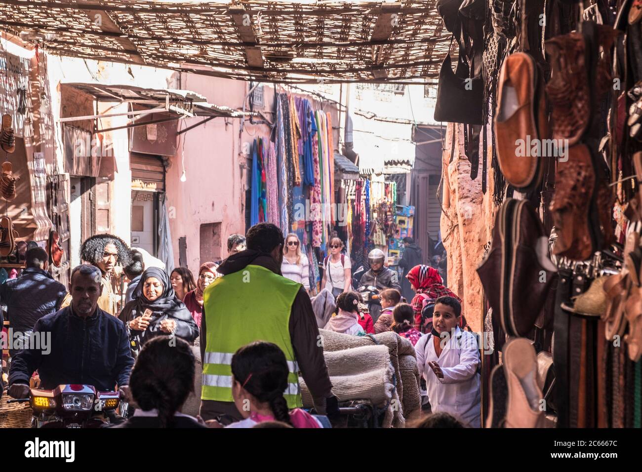 Narrow alley with shops in Souk in Marrakech, Morocco Stock Photo