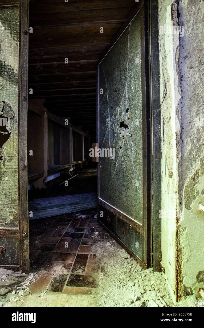 Entrance of an old abandoned hotel Stock Photo