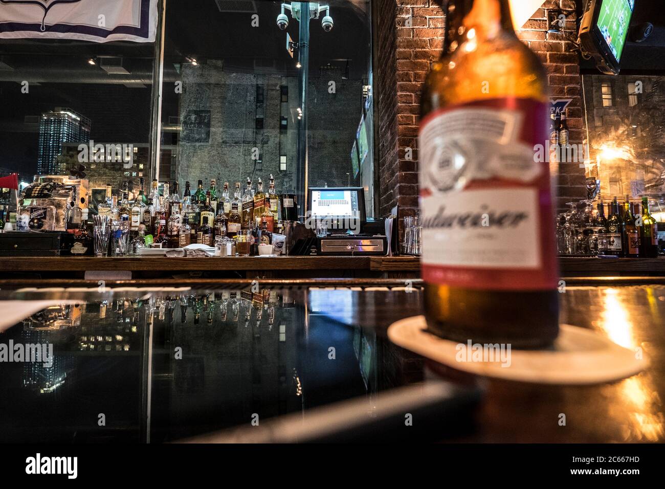 beer bottle on the counter of a bar Stock Photo