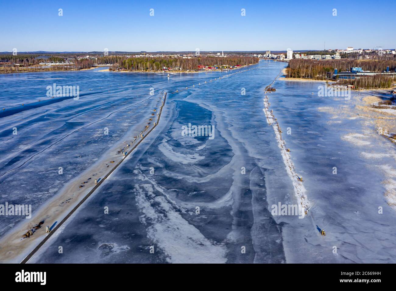 Aerial view of the Pielisjoki river near the Joensuu city. Ice-covered river in spring. Stock Photo