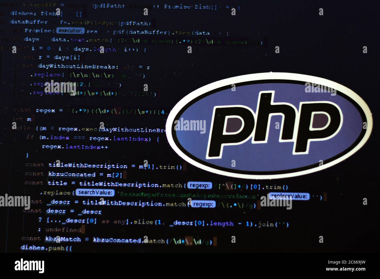 Moscow, Russia - 1 June 2020: PHP logo sign with program code on background Illustrative Editorial Stock Photo