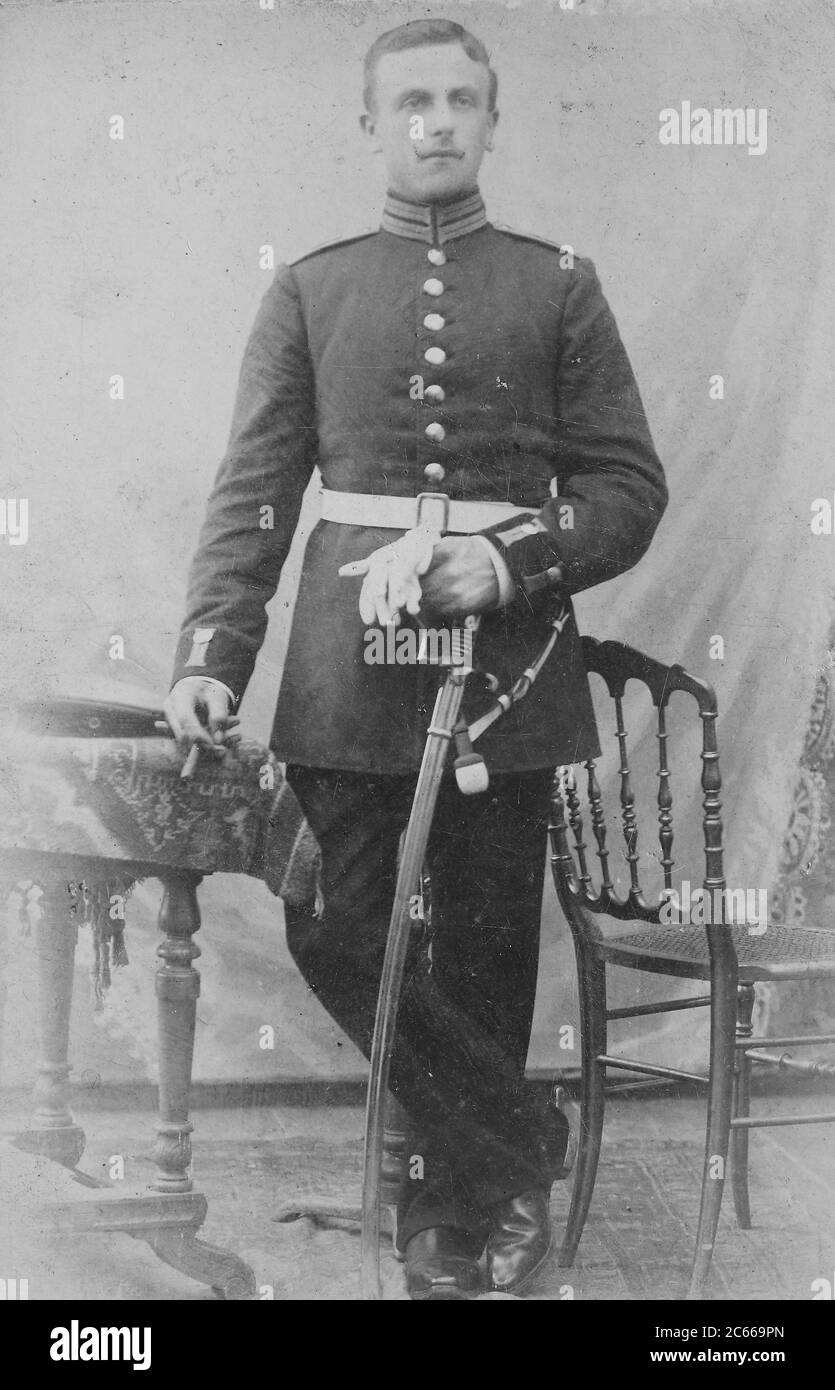 Man in uniform with sword, 1890, Germany  /  Mann in Uniform mit Säbel, 1890, Deutschland, Historisch, historical, digital improved reproduction of an original from the 19th century / digitale Reproduktion einer Originalvorlage aus dem 19. Jahrhundert, Carte de visite, a type of small photograph which was patented in 1854, each photograph was the size of a visiting card, and such photograph cards were commonly traded among friends and visitors in the 1860s  /  Visitformat, Carte de Visite, auf Karton fixierte Fotografie im Format ab ca. 6 × 9 cm, ab ca. 1860 wurde die Carte de Visite sehr popu Stock Photo