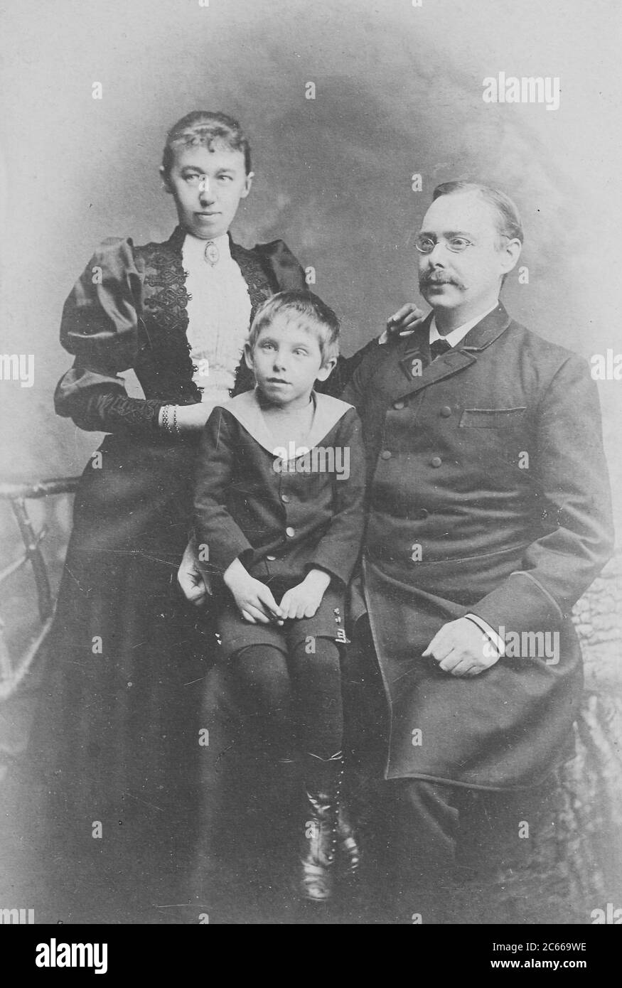 Family with a boy, couple, 1892, Munich, Germany  /  Familie mit einem Jungen, Ehepaar, 1892, München, Deutschland, Historisch, historical, digital improved reproduction of an original from the 19th century / digitale Reproduktion einer Originalvorlage aus dem 19. Jahrhundert, Carte de visite, a type of small photograph which was patented in 1854, each photograph was the size of a visiting card, and such photograph cards were commonly traded among friends and visitors in the 1860s  /  Visitformat, Carte de Visite, auf Karton fixierte Fotografie im Format ab ca. 6 × 9 cm, ab ca. 1860 wurde die Stock Photo