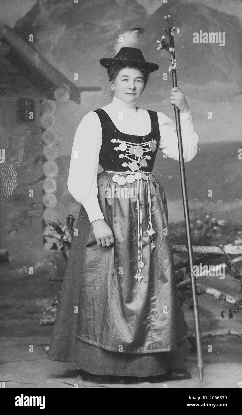 Woman from Bavaria in costume robe with Charivari jewelry chain, 1890, Germany  /  Frau aus Bayern im Trachtengewand mit Charivari Schmuckkette, 1890, Deutschland, Historisch, historical, digital improved reproduction of an original from the 19th century / digitale Reproduktion einer Originalvorlage aus dem 19. Jahrhundert, Carte de visite, a type of small photograph which was patented in 1854, each photograph was the size of a visiting card, and such photograph cards were commonly traded among friends and visitors in the 1860s  /  Visitformat, Carte de Visite, auf Karton fixierte Fotografie i Stock Photo