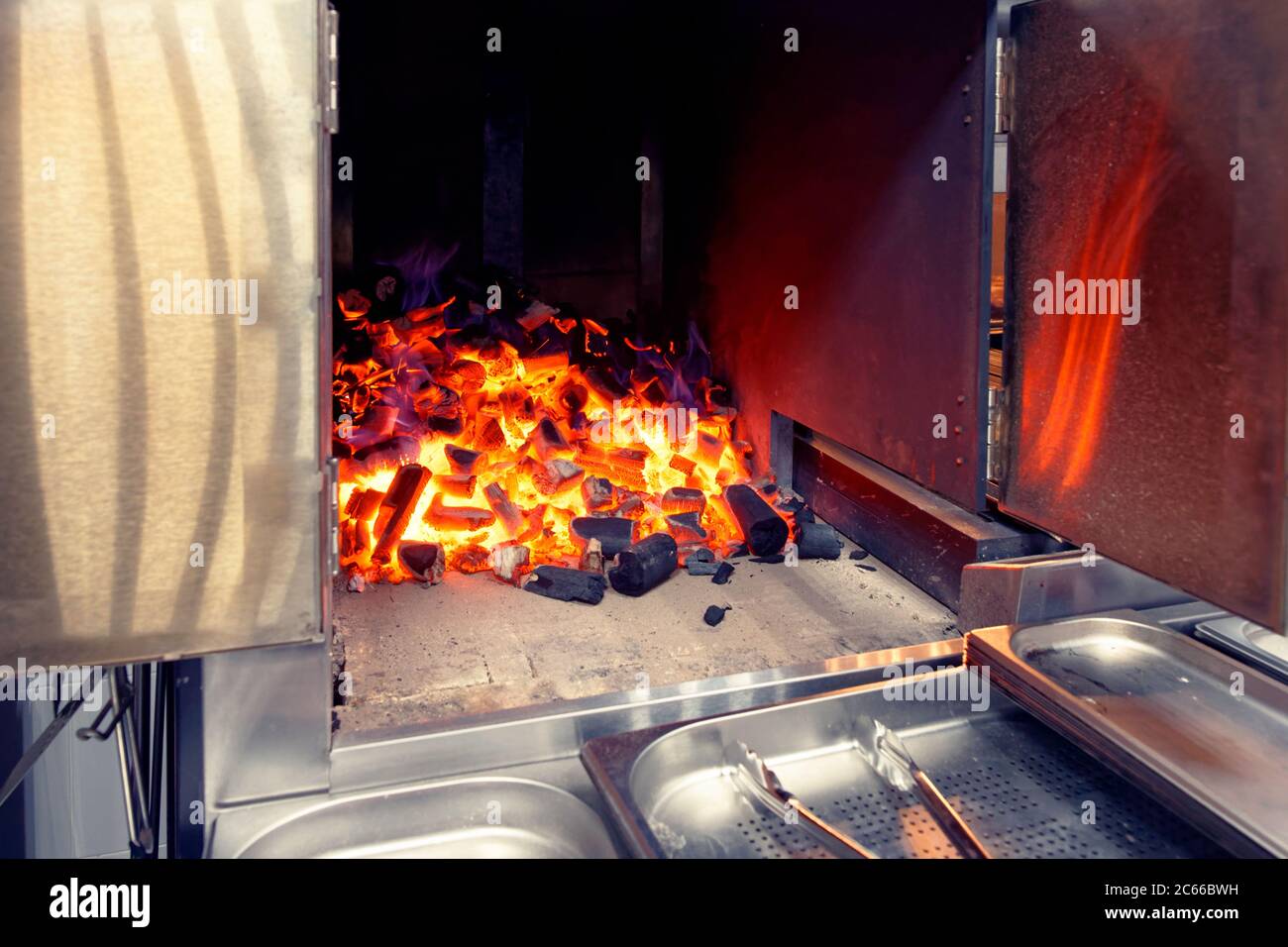 Chamber with burning charcoal, stationary grill in a restaurant, toned Stock Photo