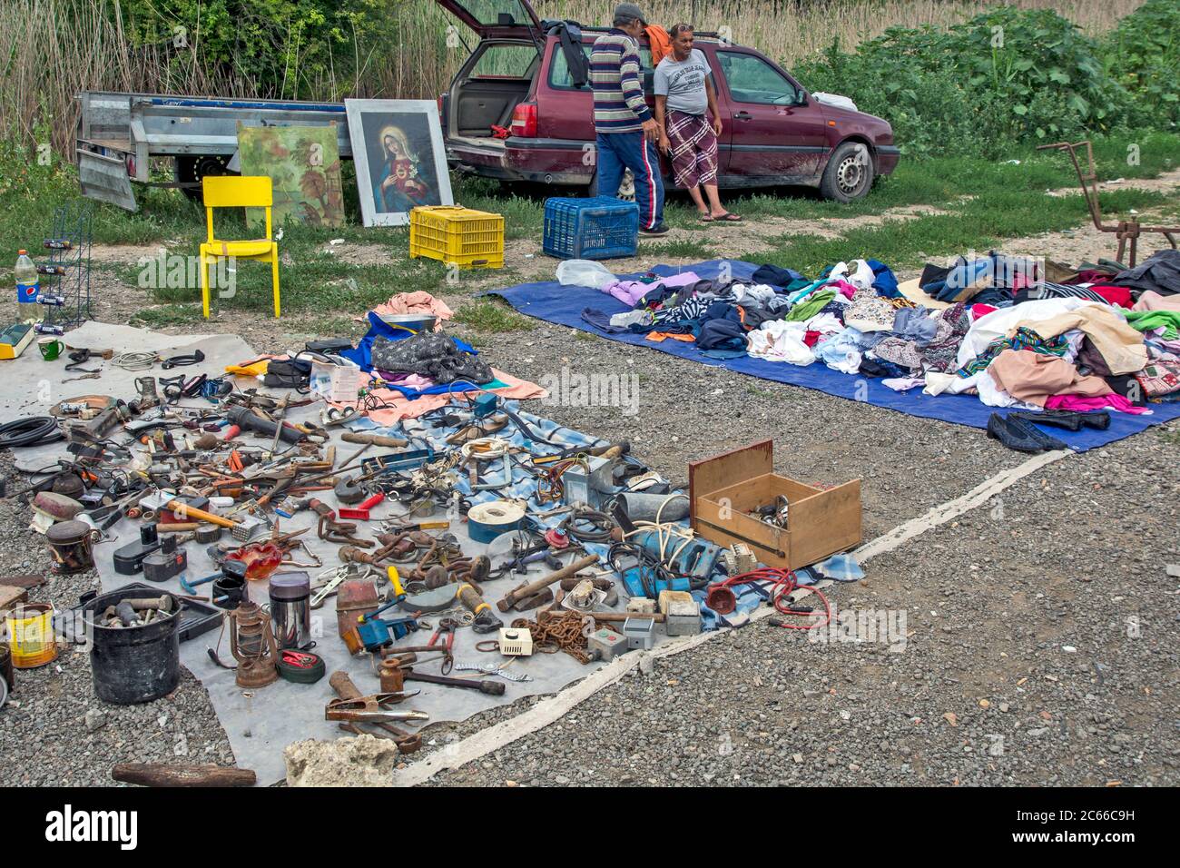 Zrenjanin, Serbia, July 04, 2020. Local flea market and sale of everything and everything. The man who sells comfortably enjoys his job. Stock Photo