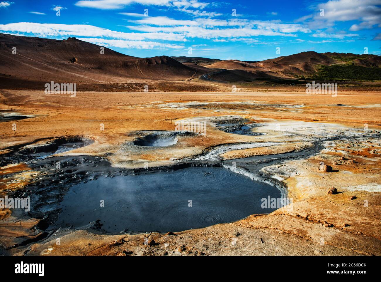 Hverir, a geothermal area known for its bubbling pools of mud & steaming fumaroles emitting sulfuric gas, Namafjall, Iceland Stock Photo
