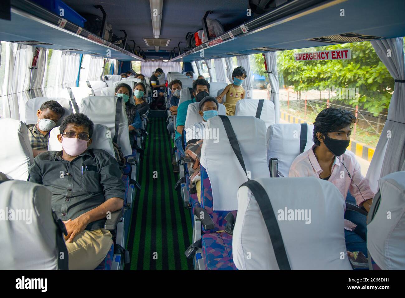 People travelling by bus to their native places during spread of pandamic disease Covid-19 Stock Photo