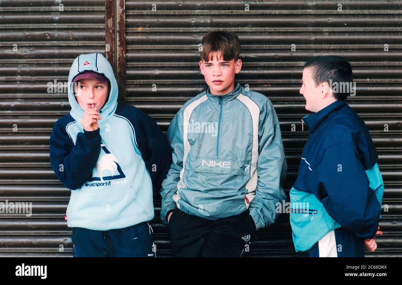 Boys hanging around shops; Bradford council estate; Yorkshire UK Stock Photo