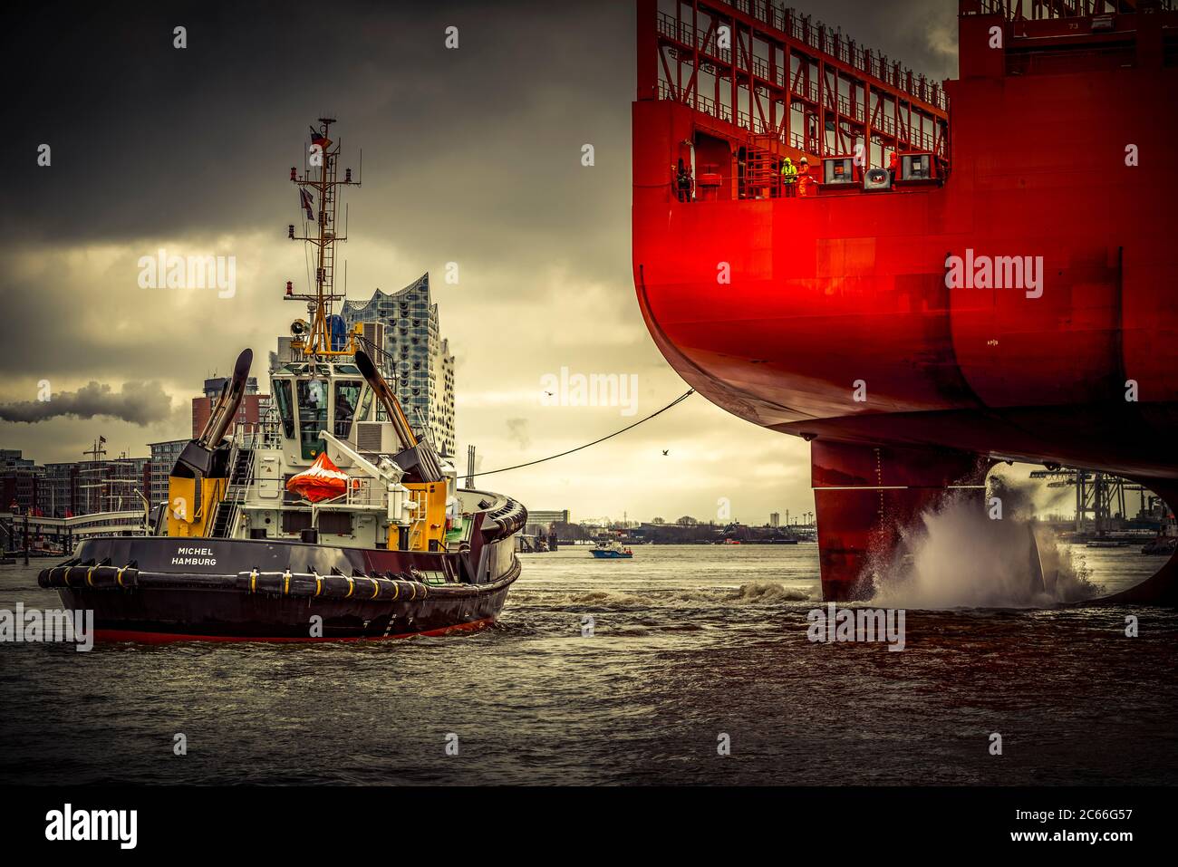 Germany, Hamburg, Elbe River, port, tugboat, dock, container ship Stock Photo