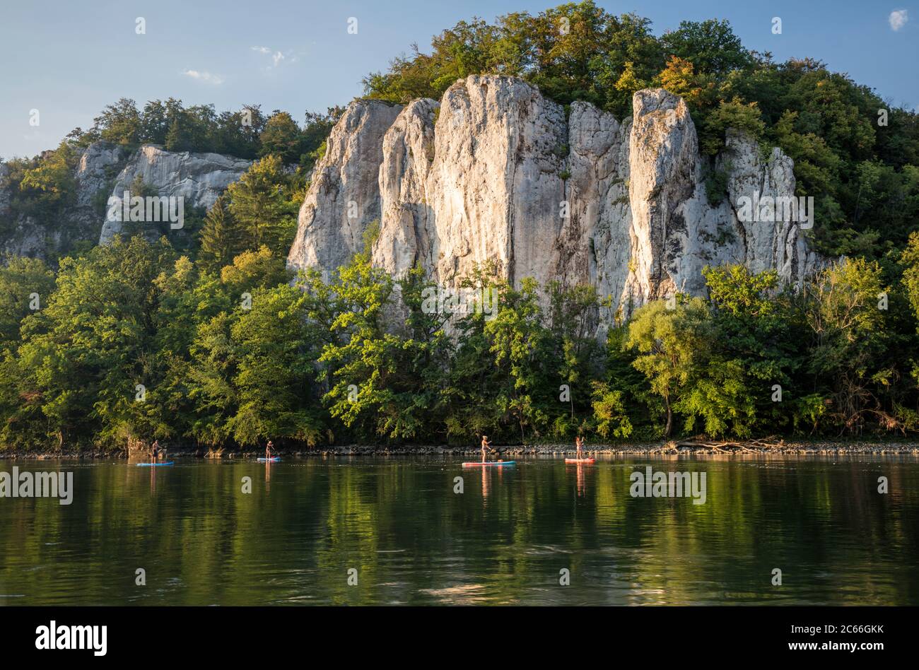 Water sports enthusiasts on stand-up paddleboards in the Weltenburg Narrows near Weltenburg Abbey Stock Photo