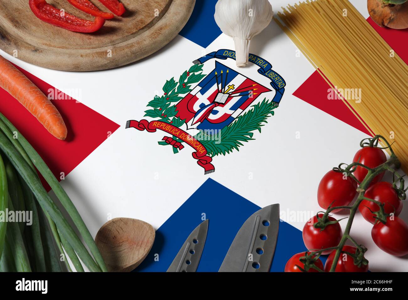 Dominican Republic flag on fresh vegetables and knife concept wooden