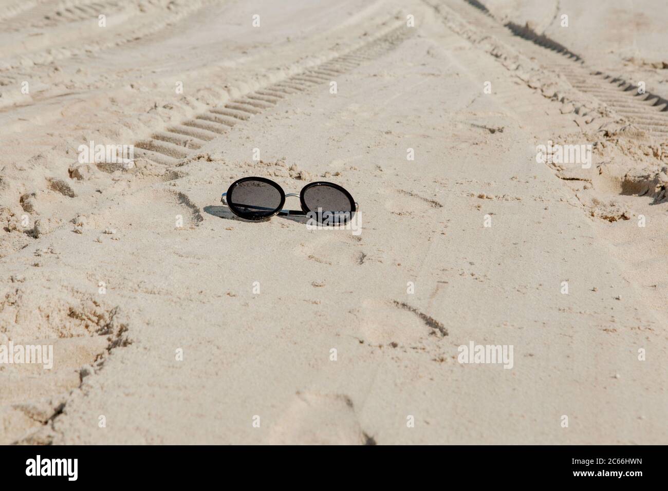 Top view of sunglasses on the beach near the blue sea with sand Stock ...