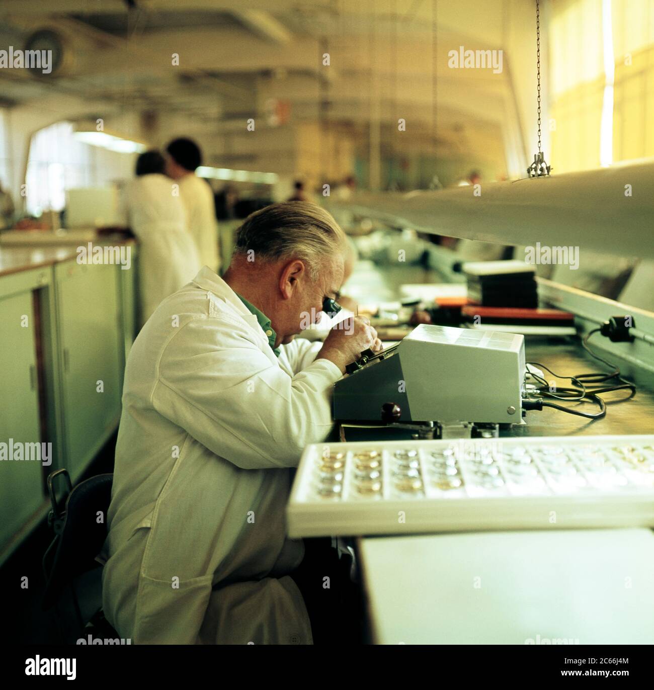 Skilled workers in white lab coats, production of watches, production site of the VEB Watch and Clock Combine, Publicly Owned Enterprise, Ruhla Stock Photo