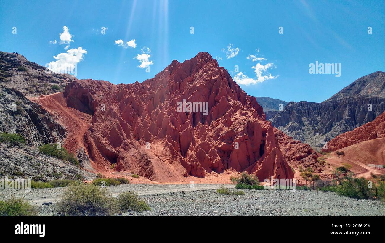 Red mountain, in the middle of a mountain landscape in Argentina Stock Photo