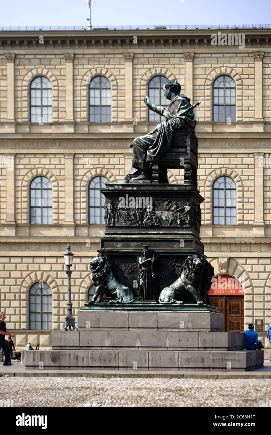 Tourists and pedestrians on Max-Joseph-Platz next to the bronze statue of King Max I, Joseph in Munich, Stock Photo