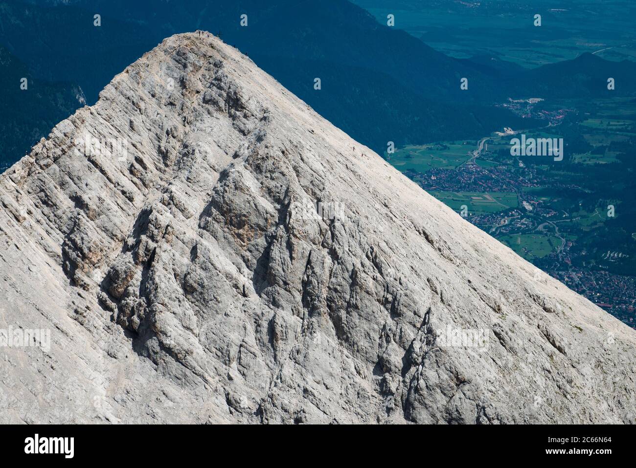 South face of Alpspitze Peak, mountaineers, Garmisch-Partenkirchen in the background, aerial view, Bavaria, Germany Stock Photo