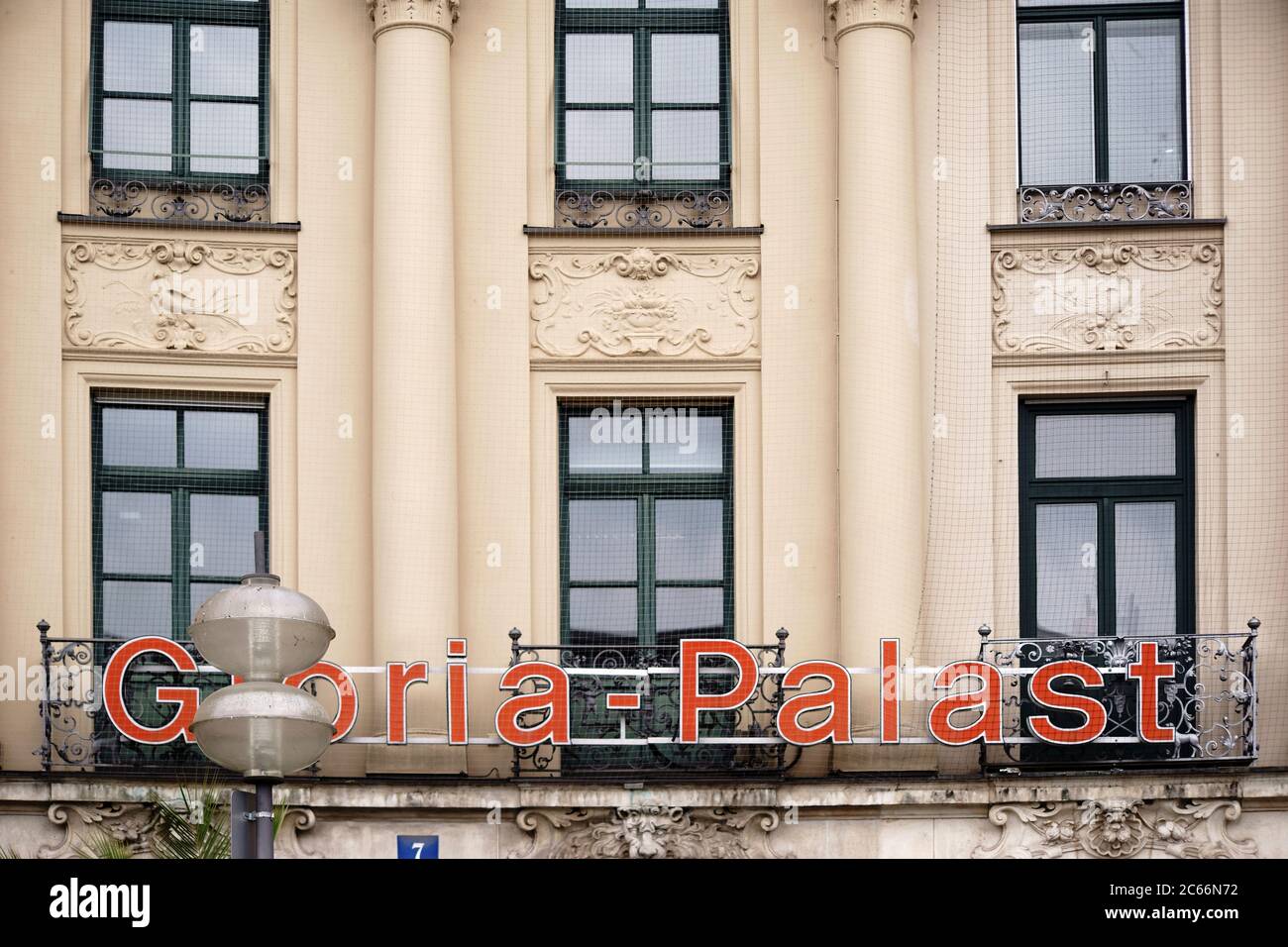 The logo of the Gloria Filmpalast on the facade of a historic building in the city center and Munich old town, Stock Photo