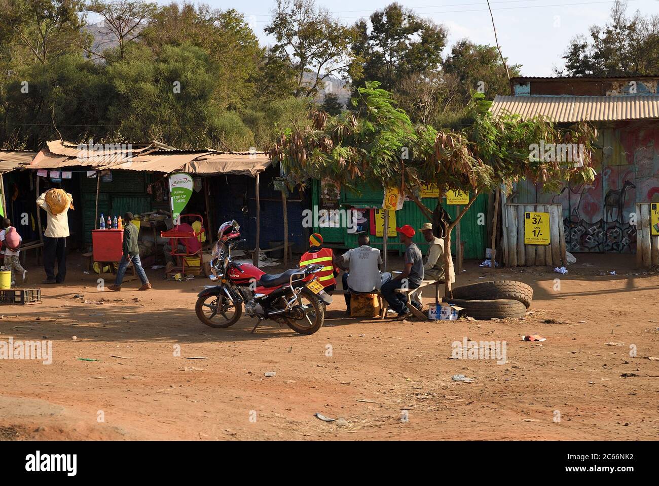 Kenya, Africa - August 22, 2010: Local people on the rural market in slum along the road nearby Nairobi Stock Photo