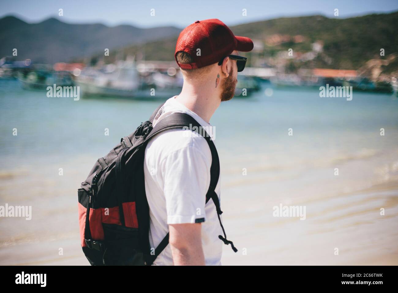 Young white blonde tourist guy in a Brazilian beach Stock Photo