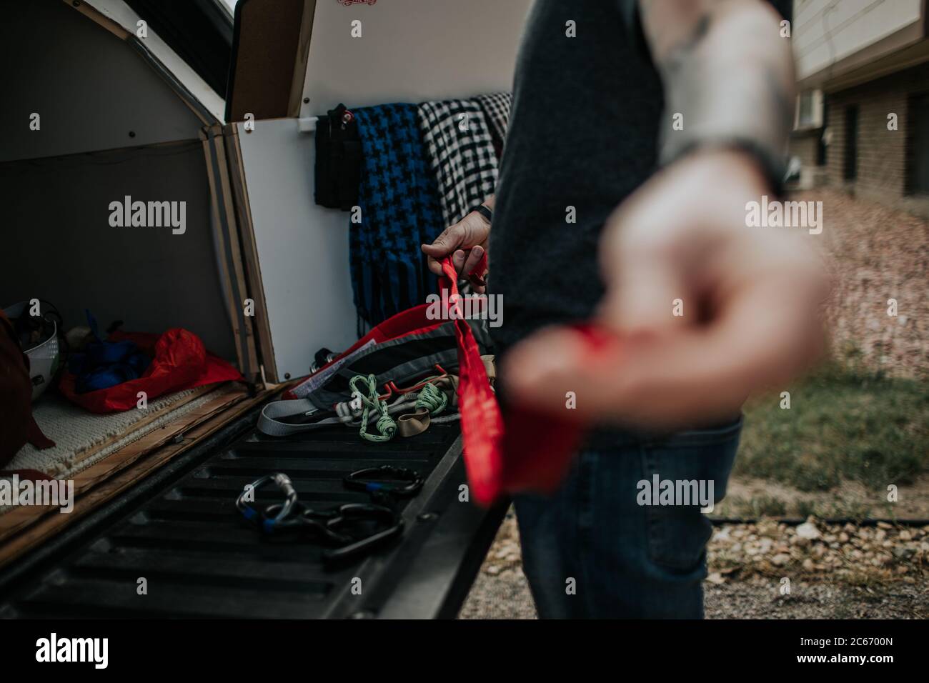 man preparing climbing ropes for rock climbing Stock Photo Alamy