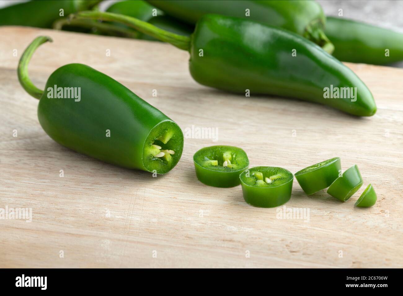 Fresh green jalapeno peppers and slices close up Stock Photo Alamy