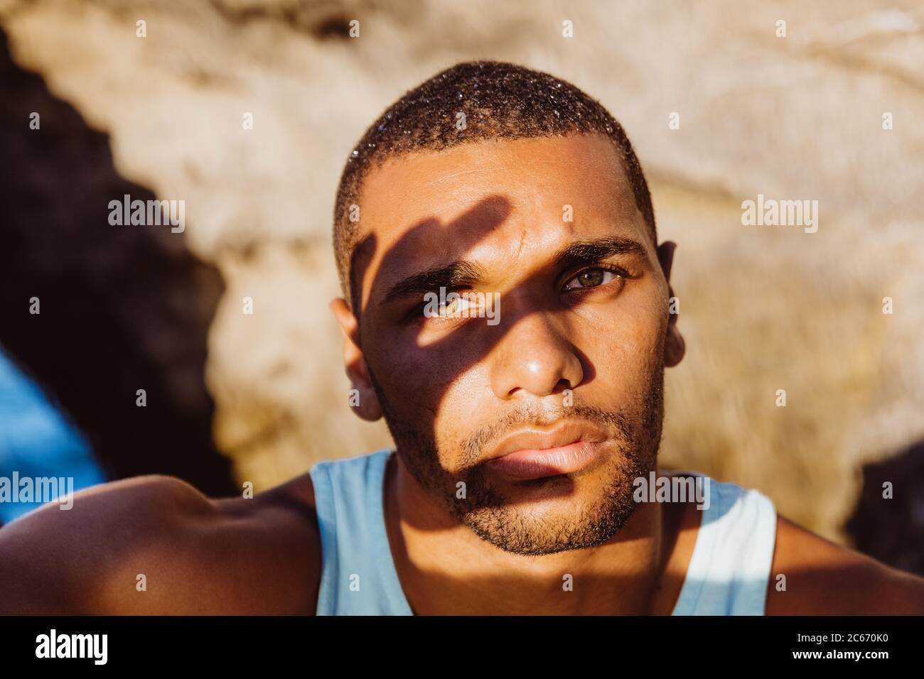 portrait of man in the shadow of his own hand Stock Photo