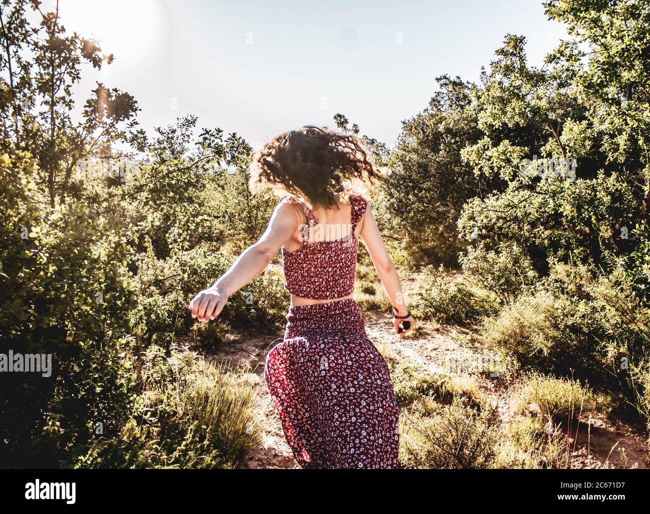 young girl running through the woods Stock Photo Alamy