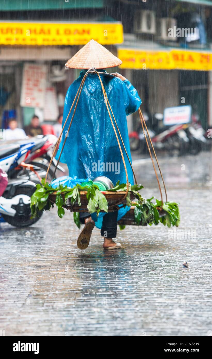 street scene in Hanoi during rainy season Stock Photo - Alamy