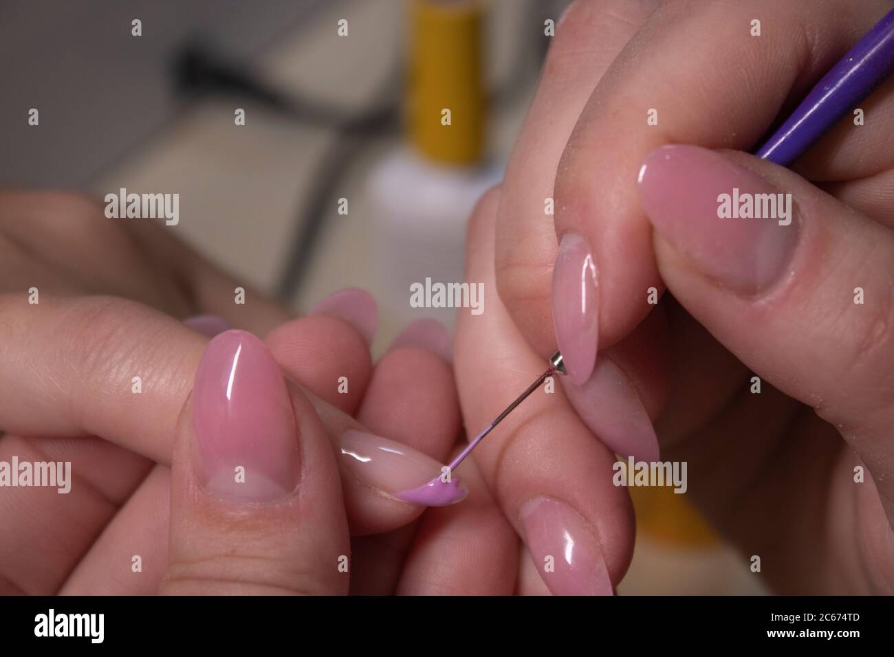 the process of doing manicure. Closeup of hands of professional manicurist, applying nail polish. Concept of doing manicure and fingernails cleaning. beauty concept. Gel polish, shellac Stock Photo - Alamy the process of doing manicure. Closeup of hands of professional manicurist, applying nail polish. Concept of doing manicure and fingernails cleaning. beauty concept. Gel polish, shellac Stock Photo - Alamy