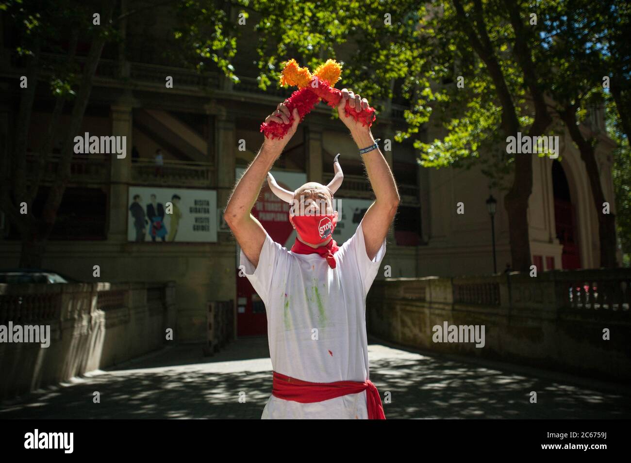 Pamplona, Spain. 07th July, 2020. A protester wearing plastic horns and ...