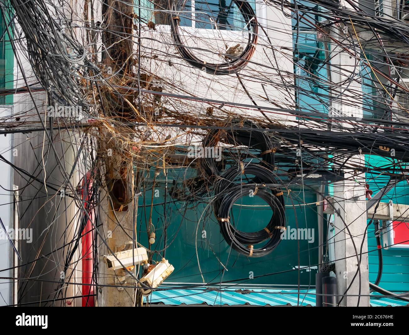 messy chaos wires cables , telephone and fiber signal line on