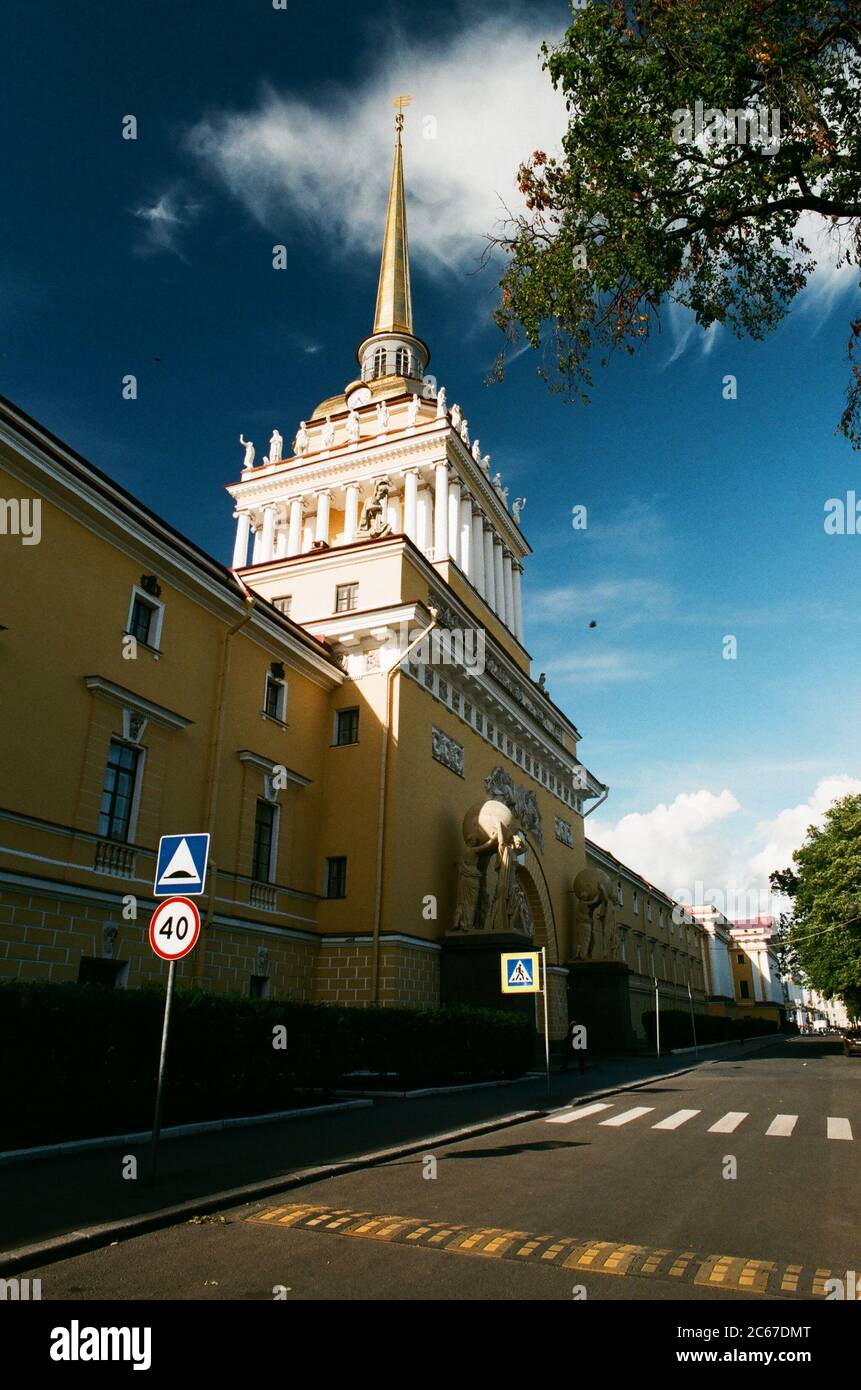 The Admiralty building in St.Petersburg, Russia with nymphs holding globes and empty street in sunny summer day copy space Stock Photo