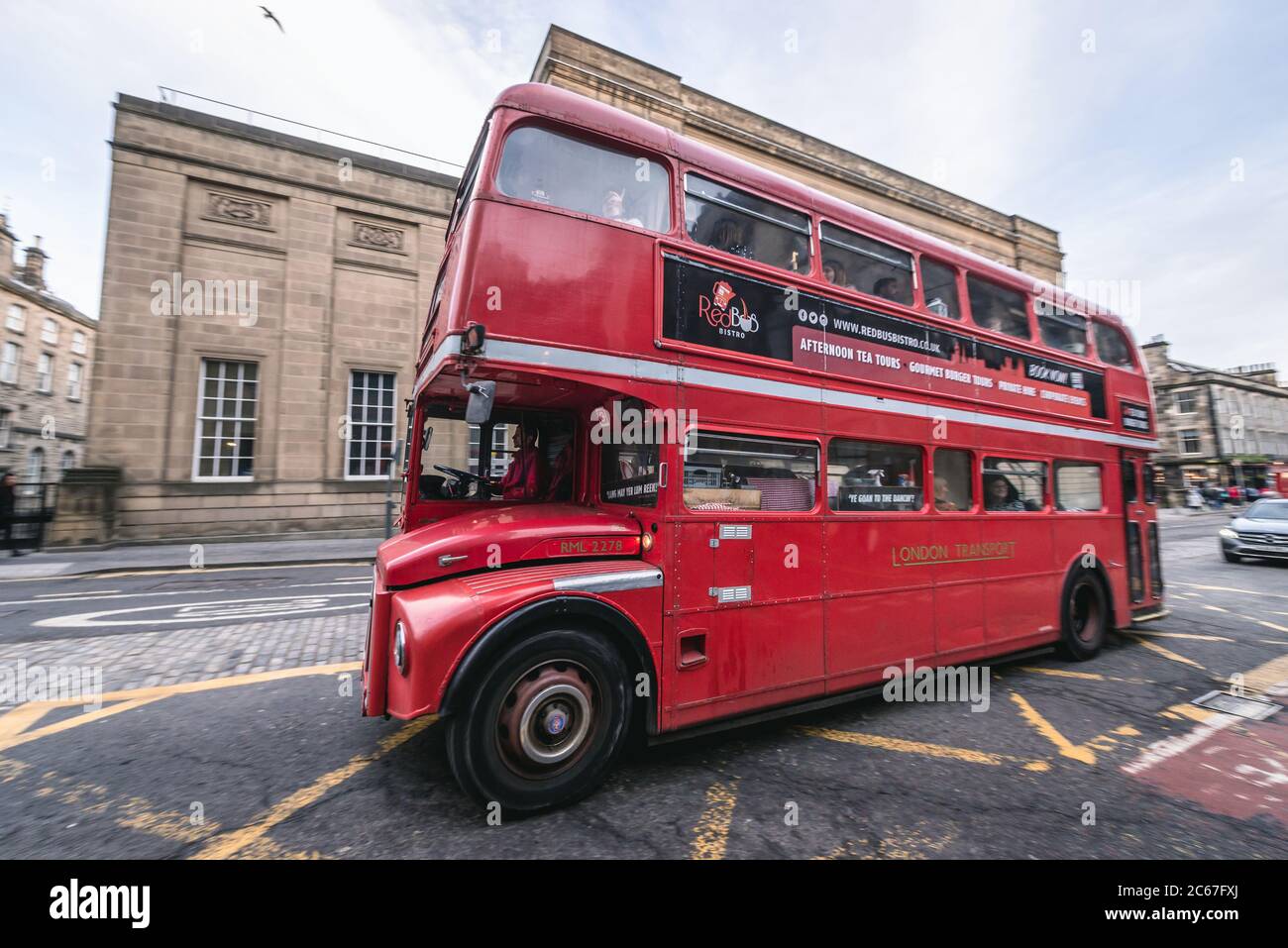 Red Bus Bistro classic tour bus on a street  in Edinburgh, the capital of Scotland, part of United Kingdom Stock Photo