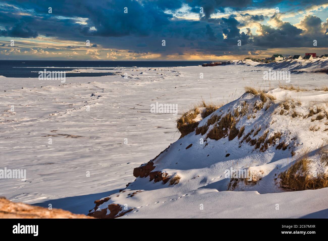 Sandunes and a beach covered in snow along  the north shore of Prince Edward Island, Canada. Stock Photo