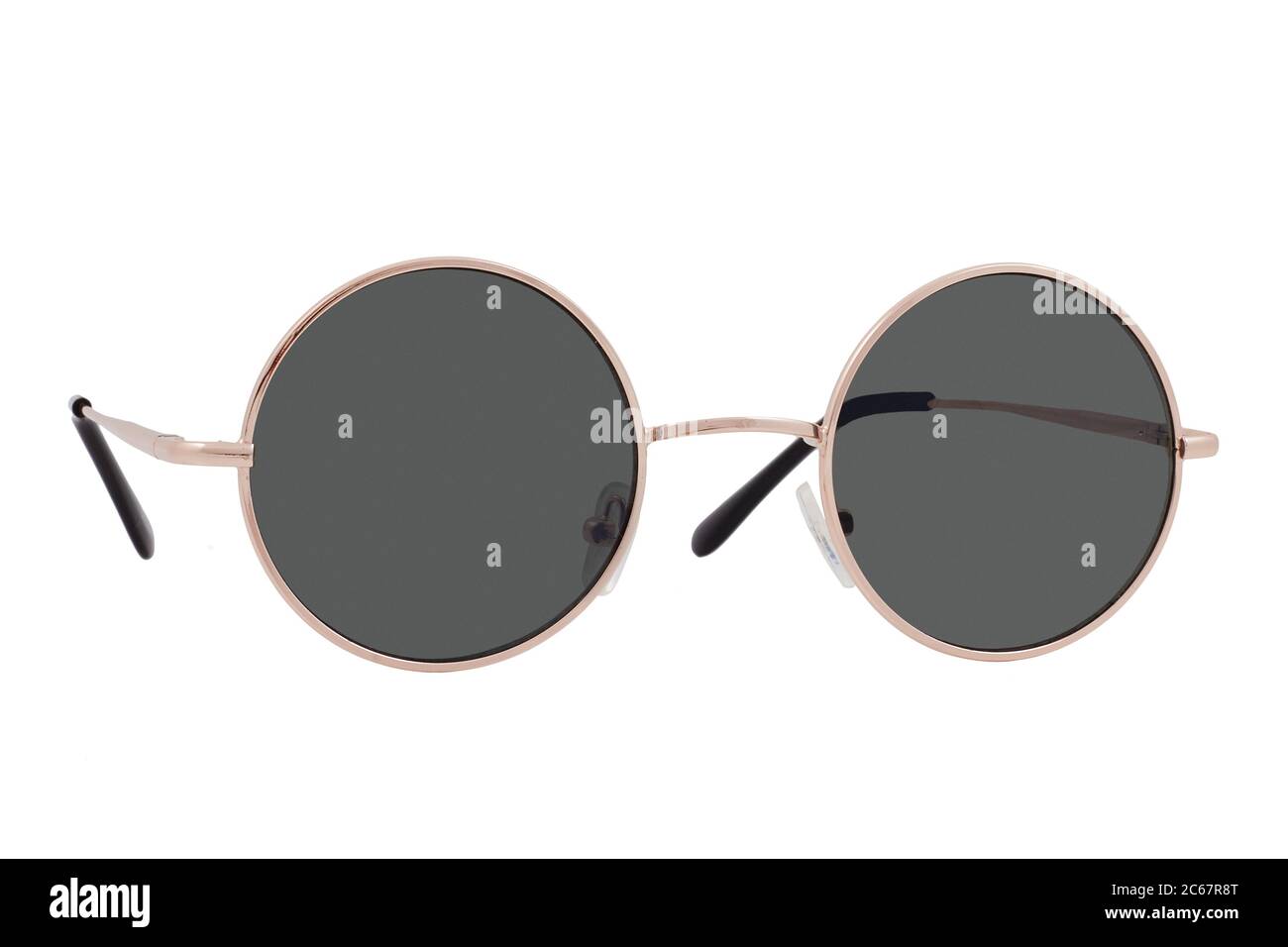 Round sunglasses with a gold frame and black lenses isolated on white  background Stock Photo - Alamy