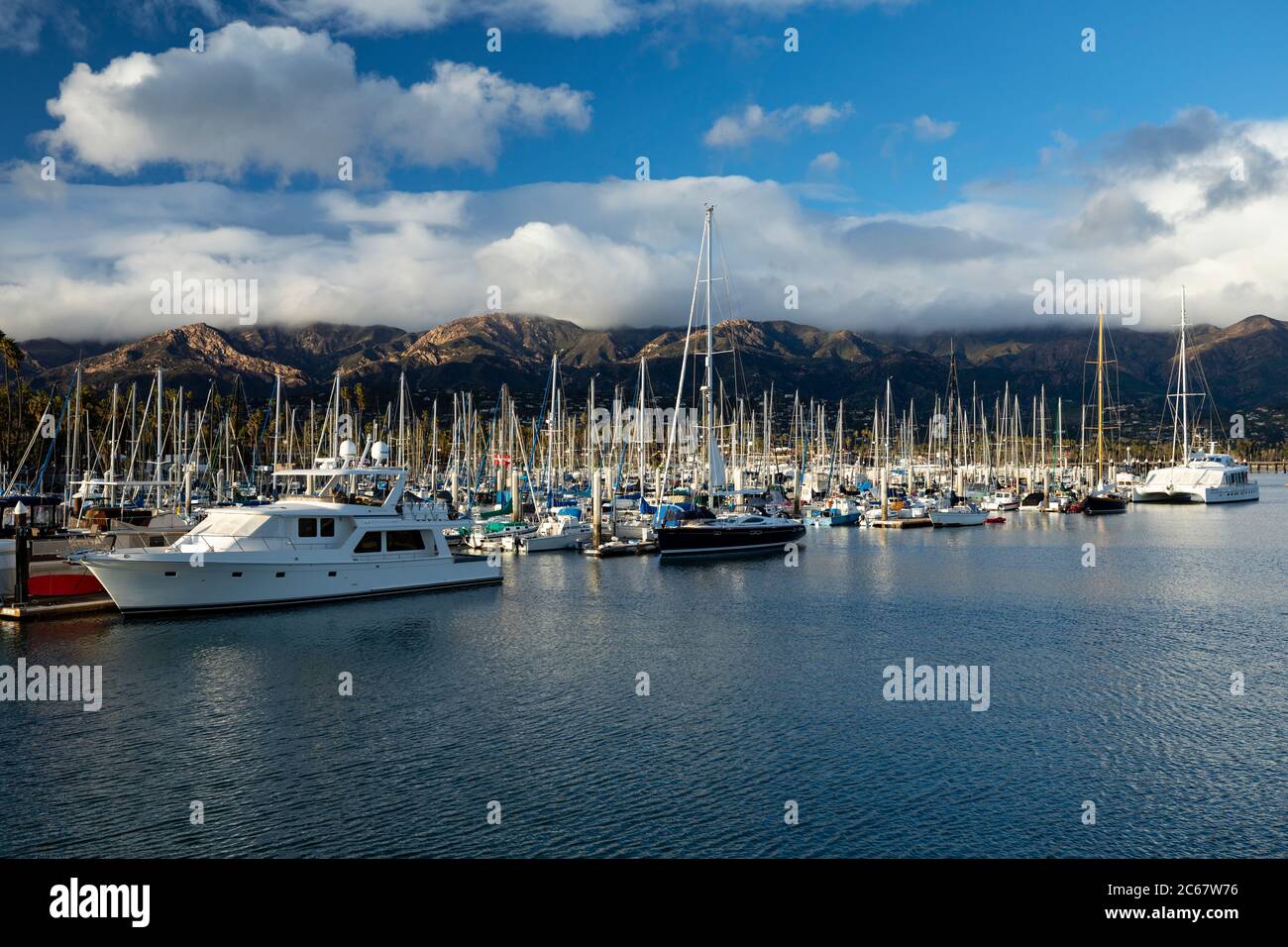 Large number of yachts moored in harbor with hills in background, Santa Barbara, California, USA Stock Photo
