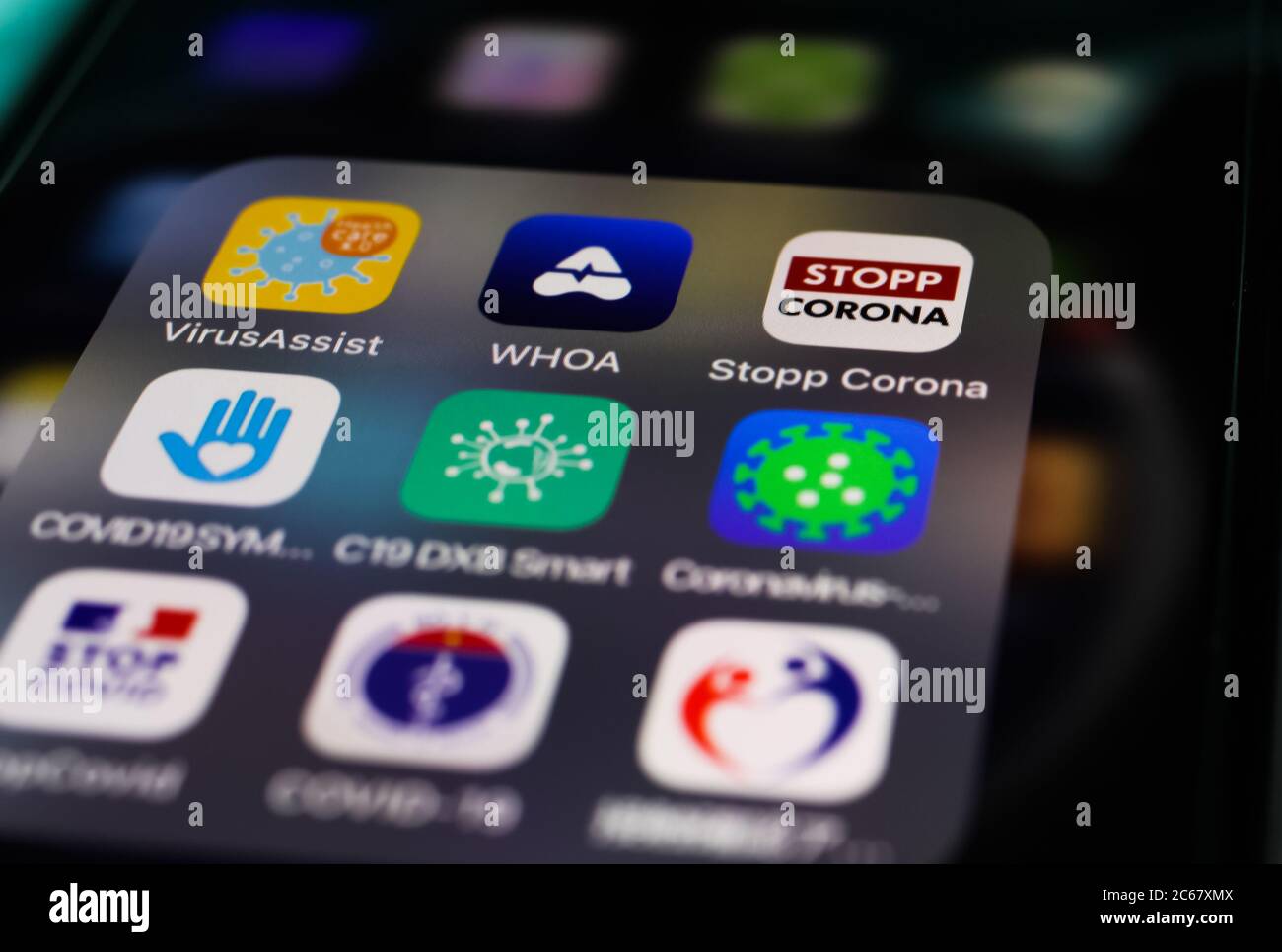 Viersen, Germany - July 7. 2020: Closeup of mobile phone screen with choice of international corona tracking apps (focus on stopp corona right upper c Stock Photo