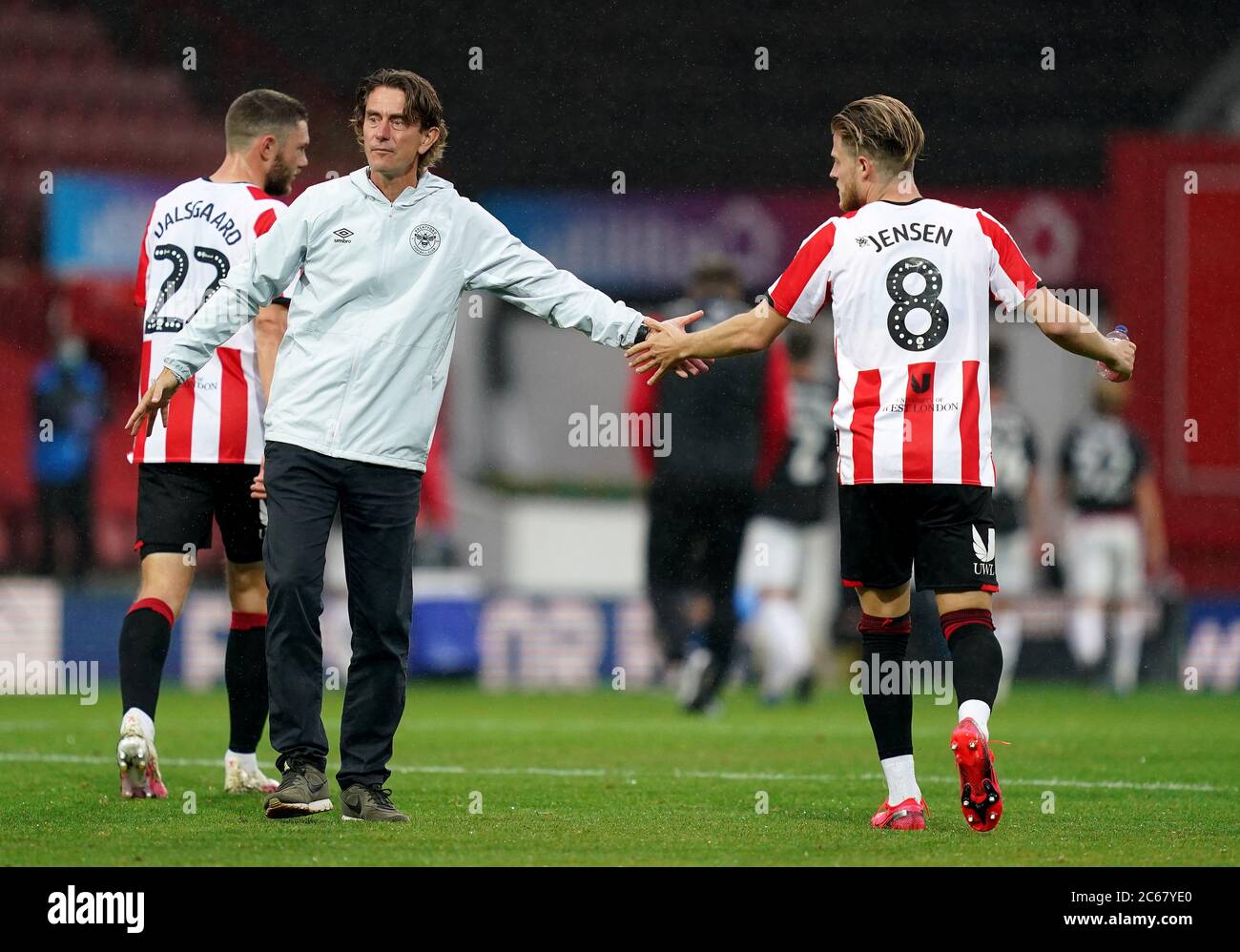Brentford manager Thomas Frank (left) with Mathias Jensen (right) after the final whistle during the Sky Bet Championship match at Griffin Park, London. Stock Photo