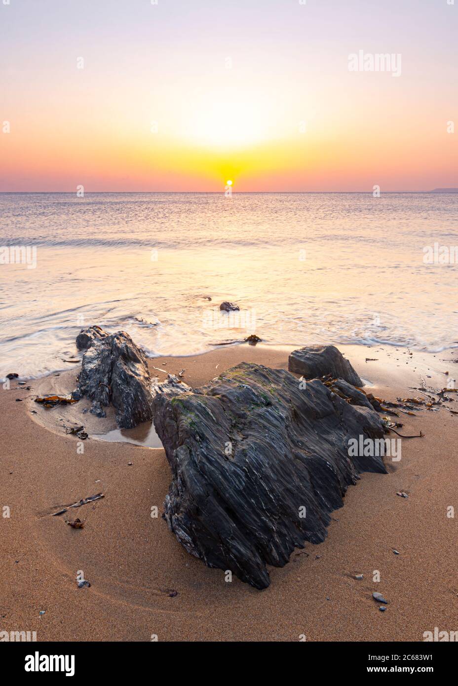 Beautiful Clear Sunset on the Beach - Hope Cove, Devon, England Stock Photo