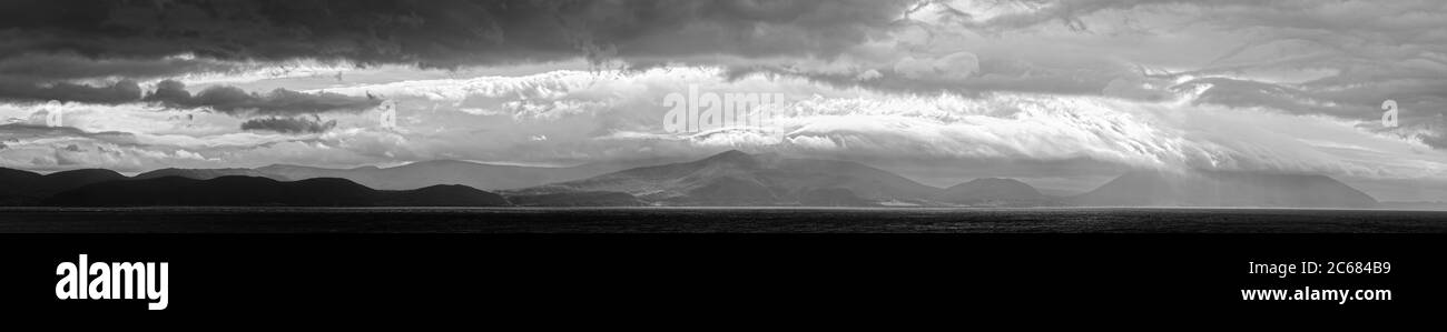 Coastline with hills and storm clouds, Dingle Peninsula, Inch, County Kerry, Ireland Stock Photo