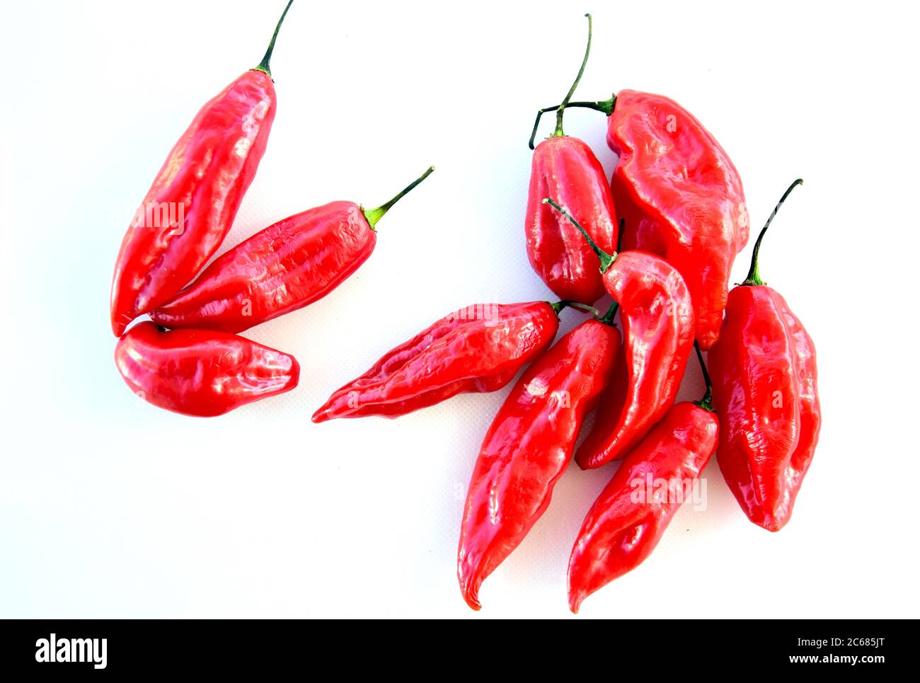 Red hot chilli peppers on white background Stock Photo - Alamy