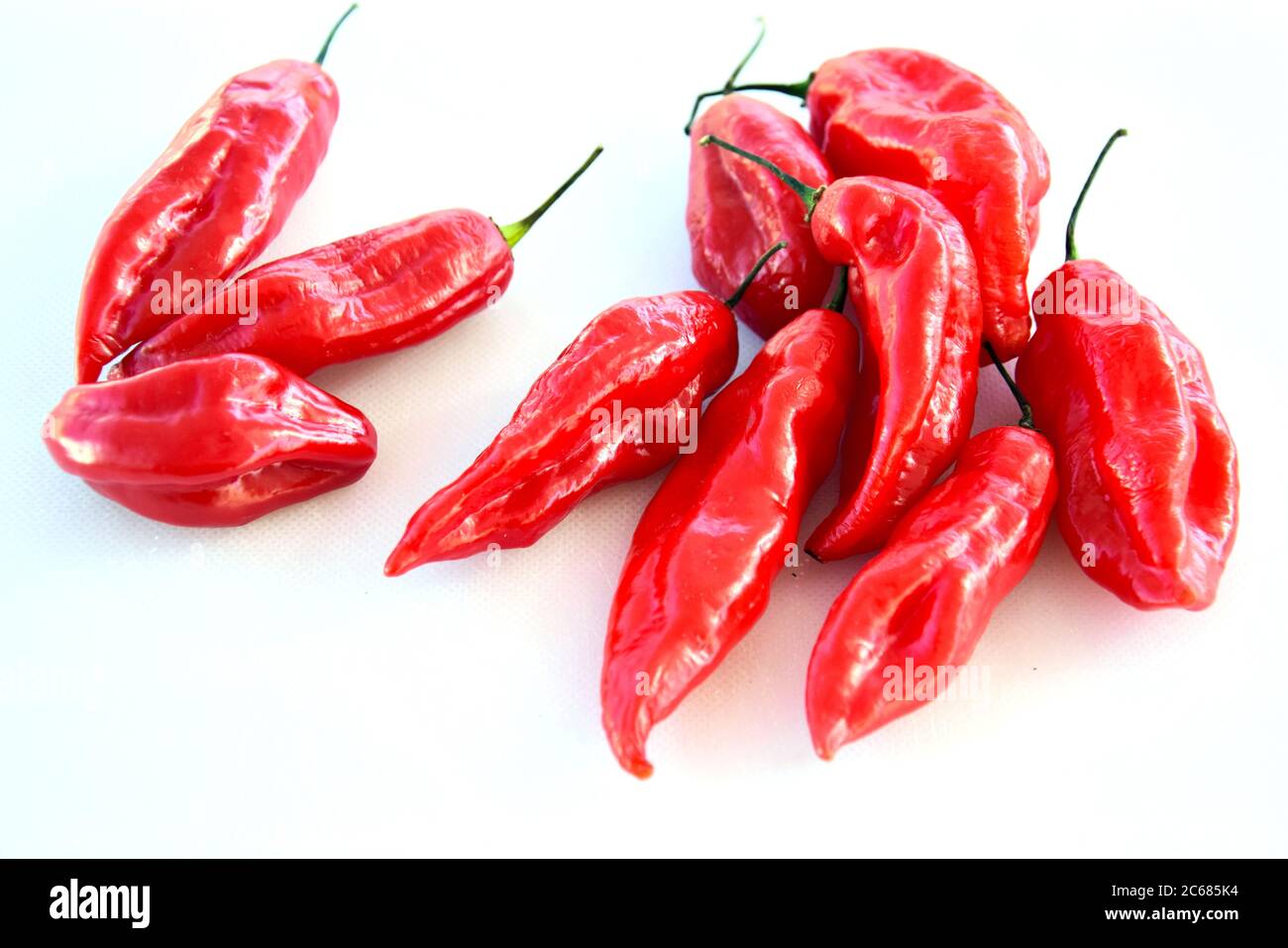 Red hot chilli peppers on white background Stock Photo - Alamy