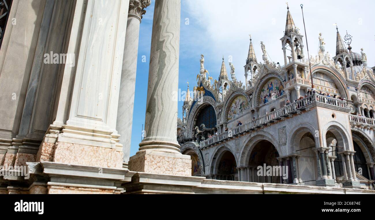 View of column of Campanile and Basilica di San Marco in Piazza San Marco, Venice, Veneto, Italy Stock Photo