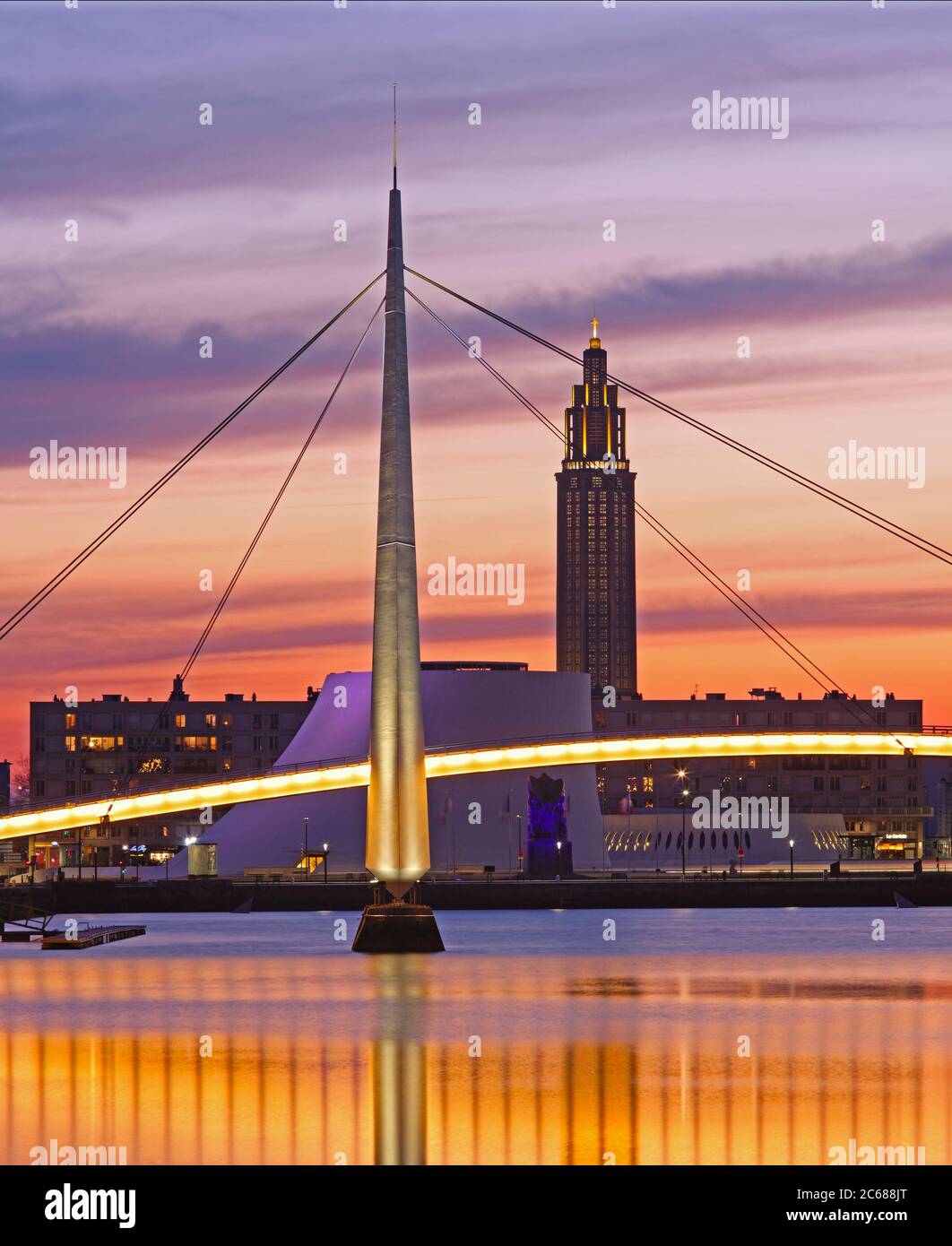 Illuminated bridge over Bassin du Commerce and Volcan at dusk, Le Havre, France Stock Photo