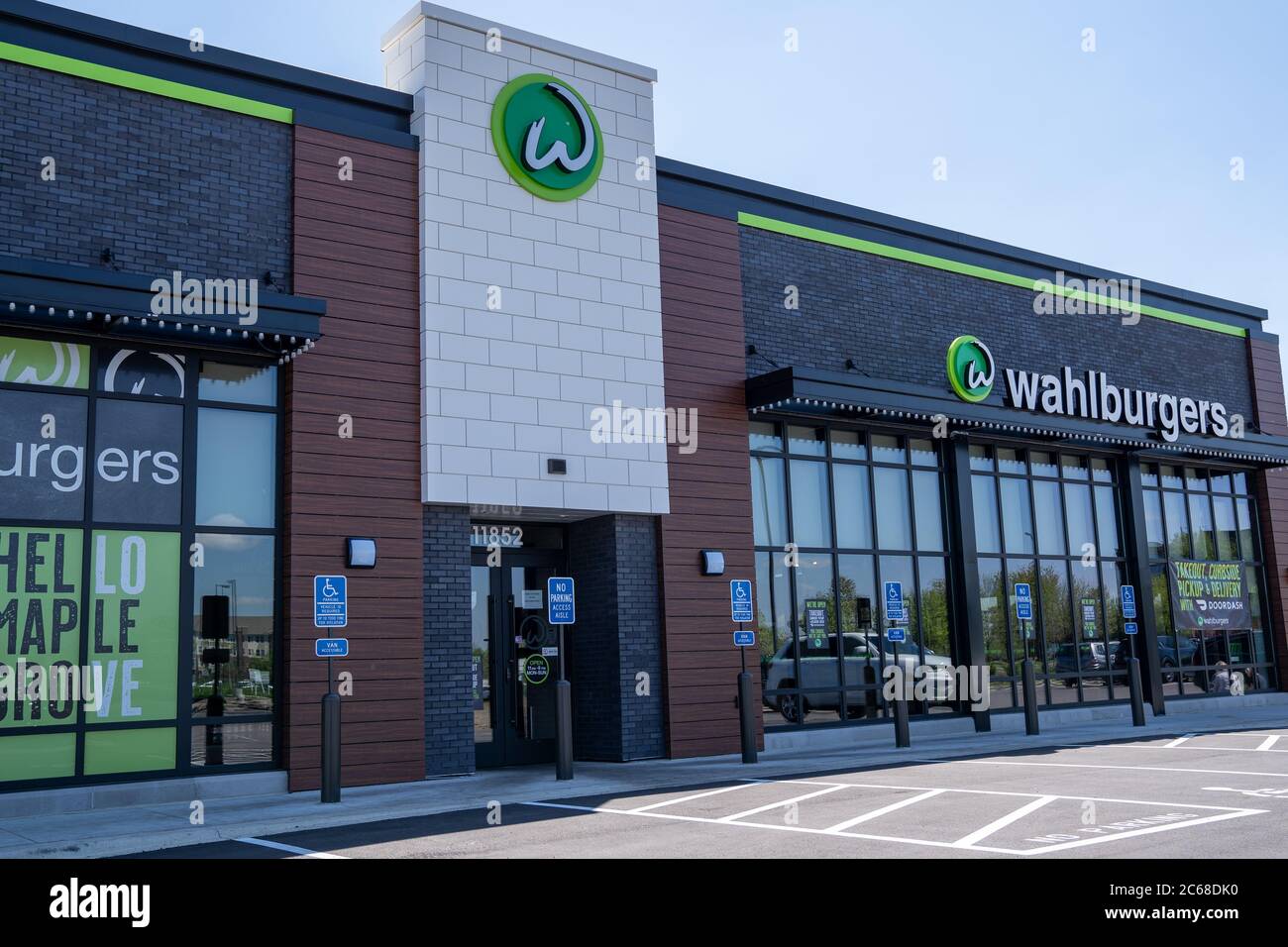 Maple Grove, Minnesota - May 20, 2020: Exterior of a Wahlburgers restaurant, owned by celebrities Mark and Donnie Walhburg and their family Stock Photo