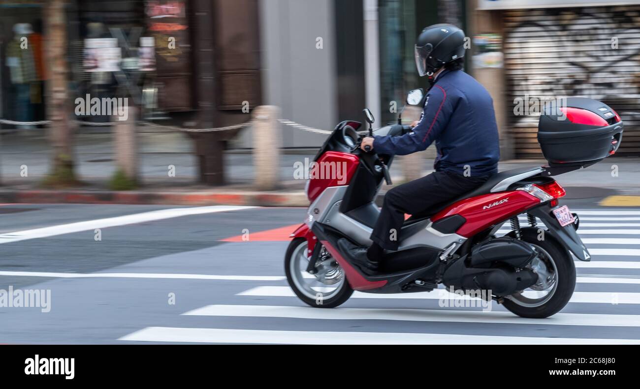 Japanese man riding a bike hi-res stock photography and images - Alamy