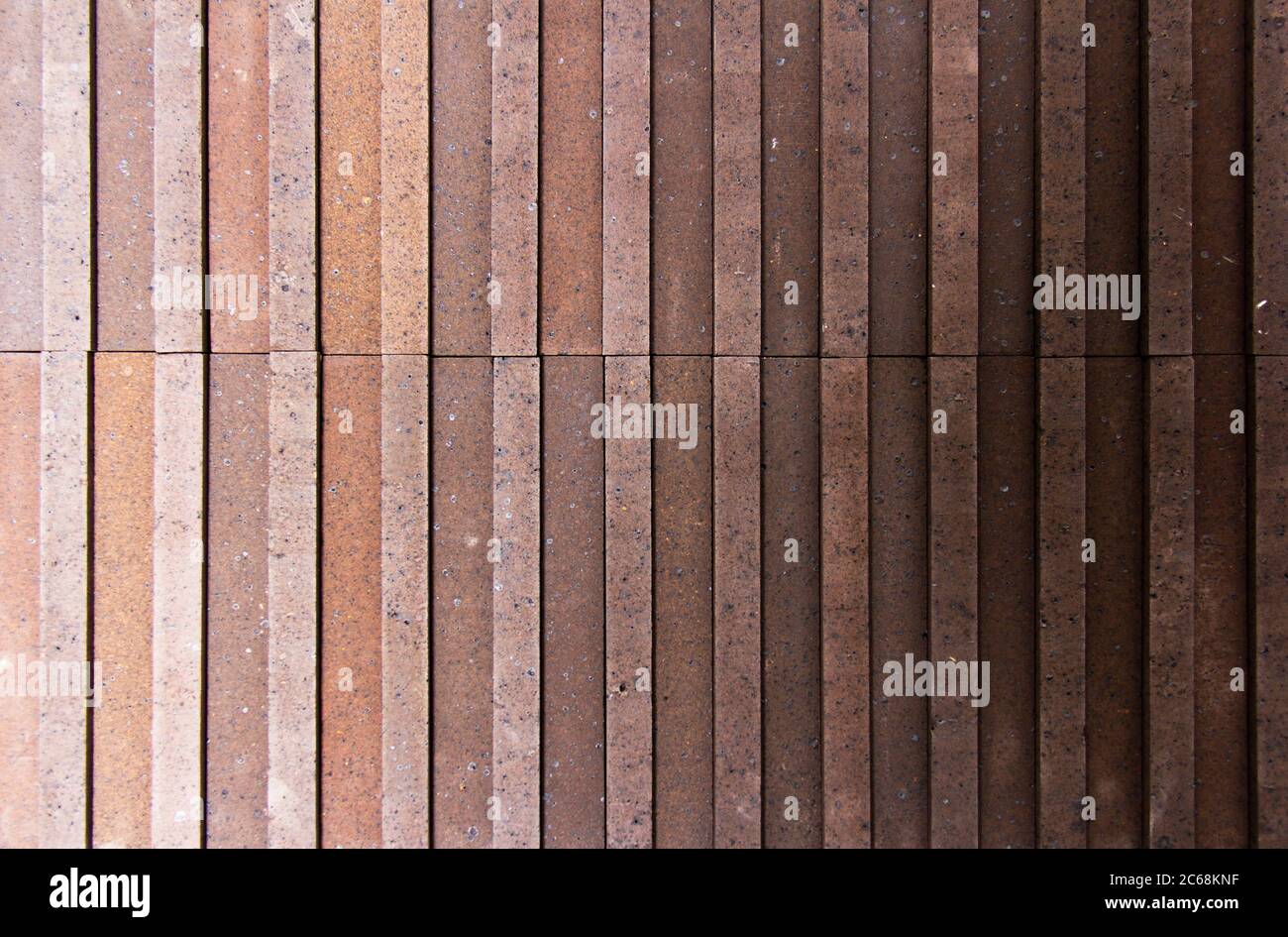 Irregular orange brick arrangement. brickwall. Stock Photo
